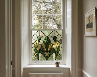 May include: A white window with a stained glass panel featuring a geometric design of green and yellow leaves. The window is set in a white frame with white shutters on either side. A small potted plant sits on the windowsill.