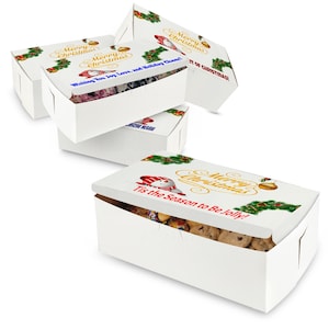 May include: Four white gift boxes with Christmas-themed designs. The boxes are stacked on top of each other. The top box has a snowman and the text "Merry Christmas! Tis the Season to Be Jolly!" The other boxes have a Christmas tree and the text "Merry Christmas! Wishing You Joy, Love, and Holiday Cheer!"