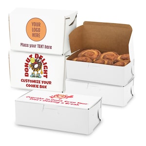 May include: Stack of white cardboard boxes with a donut design and the text "Donut Delight" and "Customize Your Cookie Box". The top box has the text "Your Logo Here" and "Place your TEXT here". The bottom box has the text "Cupcake So Good, Even Your Diet's Getting a Break".