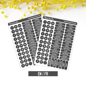 May include: Two sticker sheets featuring dark gray circular date labels numbered 1 through 31 and rectangular labels with the days of the week printed in white. The text marieanneso.etsy.com is visible at the top of each sheet, and the letters EN / FR appear below.