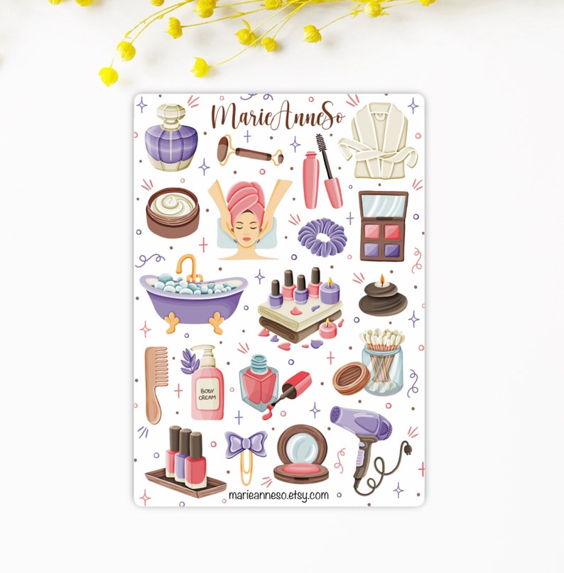 May include: A sheet of stickers featuring various spa and beauty themed illustrations, including a bath tub, a face mask, nail polish, a hair dryer, and a bathrobe. The stickers are on a white background with a pink, purple, and blue color scheme. The text "Marie Anne So" is at the top of the sheet.