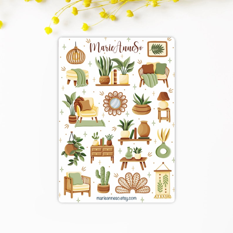 May include: A sheet of stickers featuring illustrations of home decor items in a boho style. The stickers include plants, furniture, lamps, and other decorative elements. The stickers are in shades of green, brown, and yellow. The text "MarieAnneSo" and "marianneaneso.etsy.com" are included on the sheet.