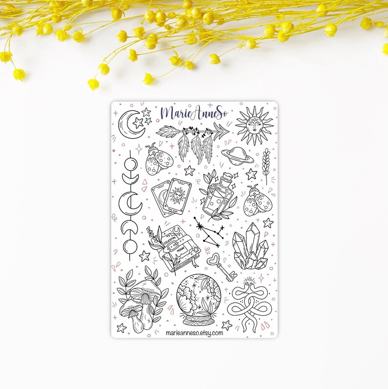 May include: A sheet of black and white stickers with a variety of mystical and witchy themed illustrations. The stickers include a crescent moon, a sun, a crystal, a snake, a mushroom, a book, a key, a bottle, a feather, a tarot card, a planet, a constellation, and a crystal ball. The stickers are on a white background and have a pink and blue color scheme. The text "MarieAnneSo" and "marianneeso.etsy.com" are included on the sheet.