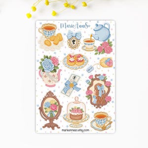 Peut inclure: Une planche d'autocollants avec des illustrations d'éléments de tea party. Les motifs comprennent des tasses à thé, des théières, des gâteaux, des roses et des cadres décoratifs aux couleurs pastel. Le texte "marieanneso.etsy.com" est visible en bas.