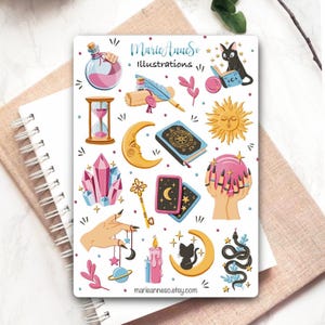 May include: A sticker sheet titled MarieAnneSo Illustrations featuring various mystical icons including a pink potion bottle, an hourglass, a crescent moon, a sun, a crystal cluster, a key, tarot cards, a crystal ball, and black cats.