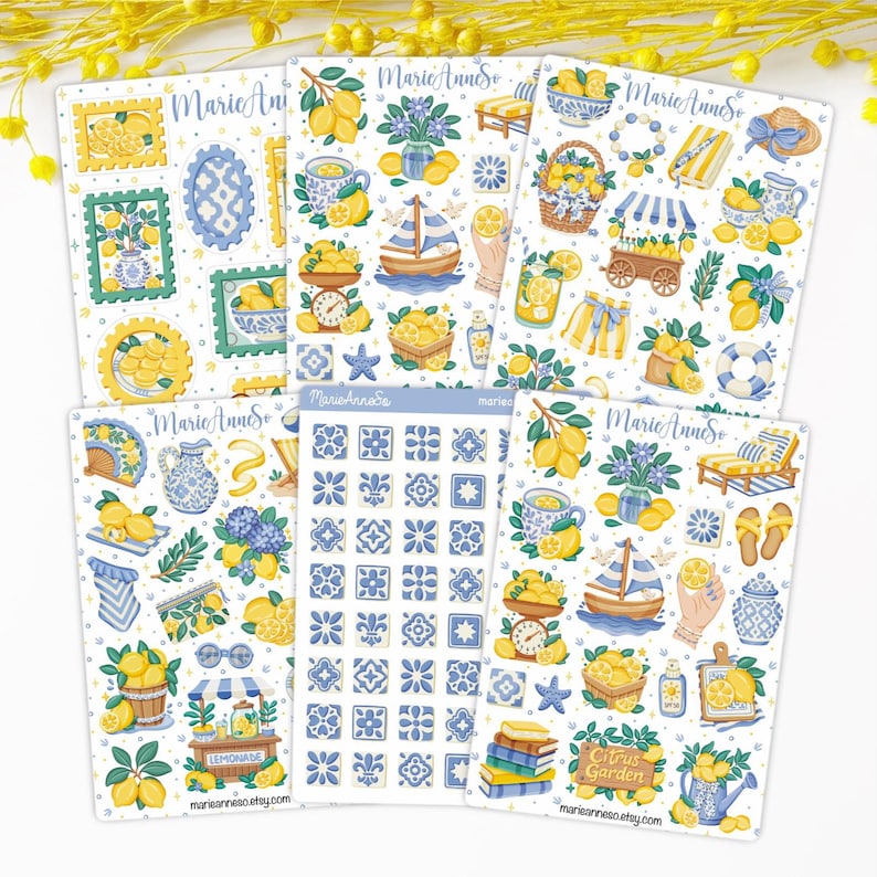 May include: A collection of decorative stickers featuring lemon and blue floral designs. The stickers include illustrations of lemons, sailboats, teacups, and tiles. The text "Marie Anne So" and "Citrus Garden" are visible.