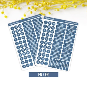 May include: Two rectangular sticker sheets featuring blue labels with white text. One sheet contains English days of the week and numbers 1 through 31 in circles. The other sheet features French days of the week and numbers 1 through 31 in circles.