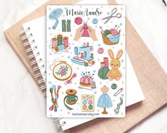 May include: A sheet of colorful stickers featuring various sewing and crafting supplies, including a sewing machine, spools of thread, buttons, a needle and thread, a thimble, a pincushion, a pair of scissors, a measuring tape, a bunny rabbit, a basket of yarn, and a dress form. The stickers are on a white background and have a whimsical, vintage aesthetic.