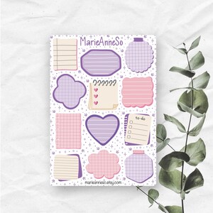 May include: A sheet of decorative sticky notes in various shapes and colours, including purple, pink, and beige. The notes feature lined, grid, and blank designs, with a heart and cloud shape. The text "MarieAnneSo" and "marieanneso.etsy.com" are visible.