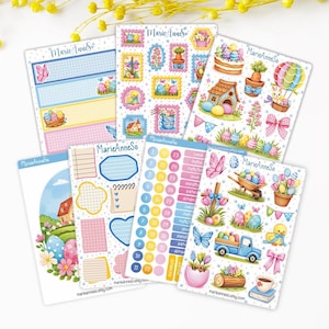 Peut inclure: Ensemble d'autocollants et de feuilles de planification sur le thème de Pâques. Les motifs incluent des œufs, des lapins, des fleurs et des papillons aux couleurs pastel. Le texte "Marie AnneSo" est visible. Diverses formes et tailles.