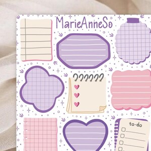 May include: A collection of purple and pink sticky notes and shapes on a white background. The notes feature lined and grid patterns, hearts, and a to-do list. The text "MarieAnneSo" is at the top.