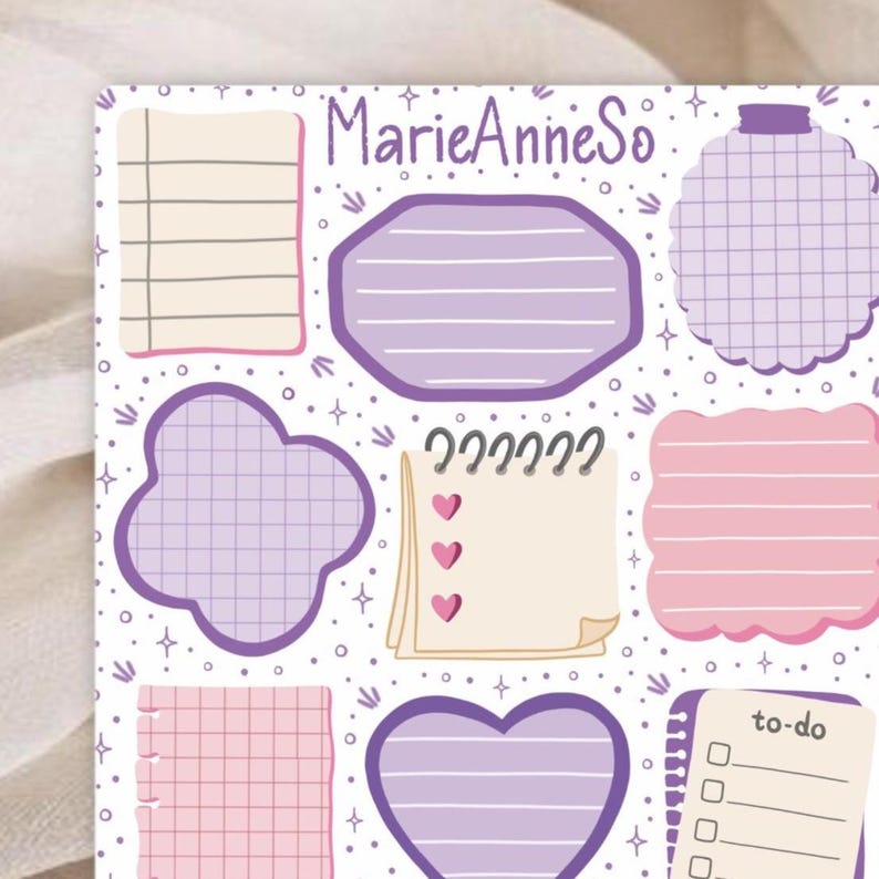 May include: A collection of purple and pink sticky notes and shapes on a white background. The notes feature lined and grid patterns, hearts, and a to-do list. The text "MarieAnneSo" is at the top.