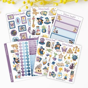 May include: A selection of decorative stickers with witchy and mystical designs. The stickers depict witches, cats, moons, stars, potions, and other magical elements. The stickers are in various shapes and sizes, with the text "Marie Anne" on some.