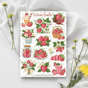 May include: A white notebook featuring various strawberry illustrations, including an ice cream cone, chocolate, and a basket of strawberries. The notebook has the text "MarieAnneSo" and "marieanneso.etsy.com".