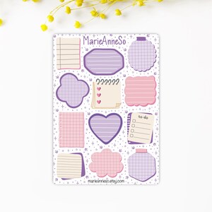 May include: A sticker sheet with a variety of notepad designs in pink, purple, and cream. Some have lines, grids, or heart shapes. The text "MarieAnneSo" and "marieannieso.etsy.com" are visible. Ideal for journaling and planning.