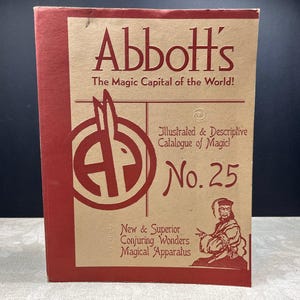 May include: A vintage catalog titled "Abbott's The Magic Capital of the World!" with red and tan cover. The cover features the text "Illustrated & Descriptive Catalogue of Magic! No. 25" and an illustration of a magician.