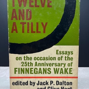 May include: A vintage book with a green and black cover. The title "Twelve and a Tilly" is in red. The book's cover includes the text "Essays on the occasion of the 25th Anniversary of Finnegans Wake", edited by Jack P. Dalton and Clive Hart.