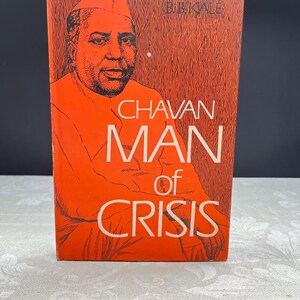 May include: A vintage book with an orange cover featuring a portrait of a man in a cap. The title "CHAVAN MAN of CRISIS" is displayed in white lettering. The author's name, B.B. KALE, is at the top.