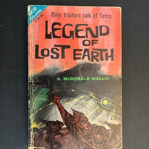 May include: A vintage paperback book titled Legend of Lost Earth by G. McDonald Wallis. The cover features a red and black illustration of a figure with a raised arm amidst yellow light lines, with the text Only traitors talk of Terra at the top.