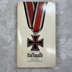 May include: A paperback book titled "A History Of The Luftwaffe 1915-1945" by John Killen. The cover features a black and brown Iron Cross medal with a red ribbon. The book is a Berkeley Medallion Book.