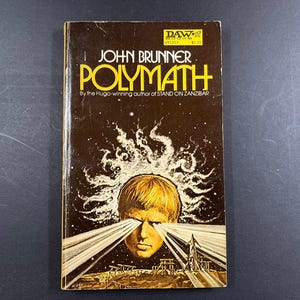 May include: A vintage mass-market paperback book titled Polymath by John Brunner. The dark brown cover features a central illustration of a person with light emanating from their eyes, set against a starry background with a small rocket ship.