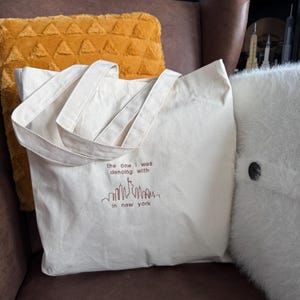 the one i was dancing with in new york maroon midnights inspired embroidered tote bag