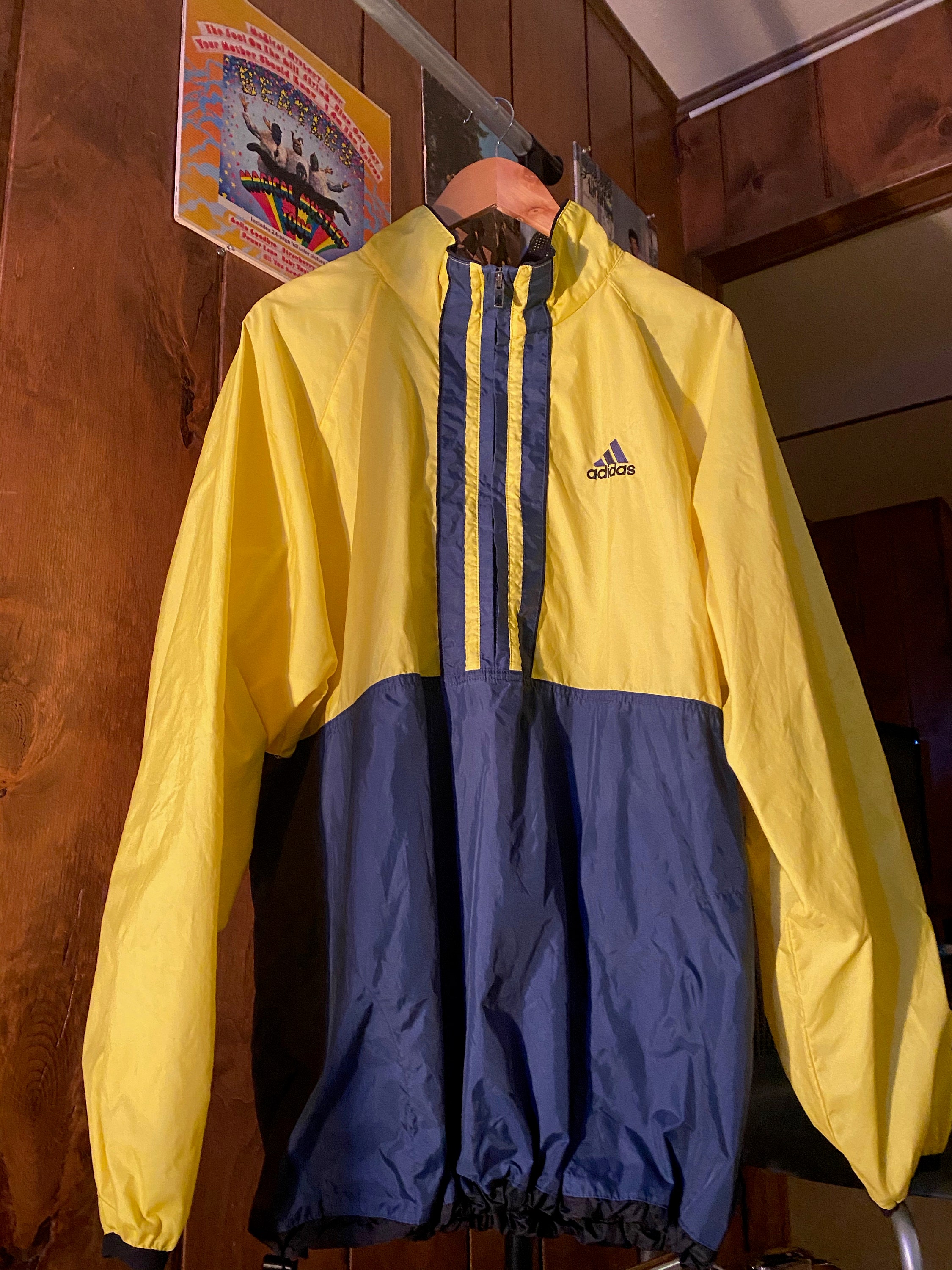 yellow and navy blue windbreaker