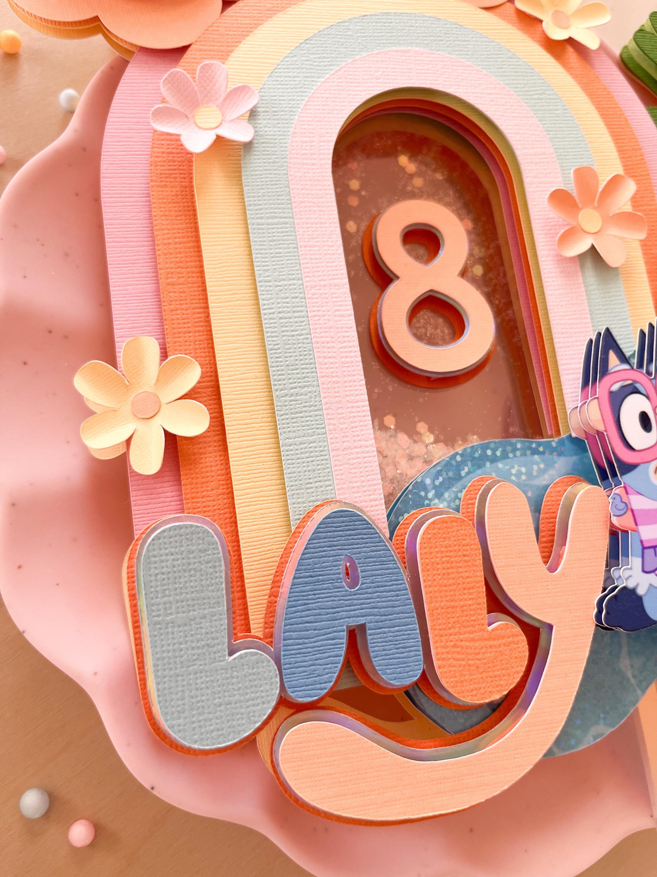 Blue and orange dog cake topper