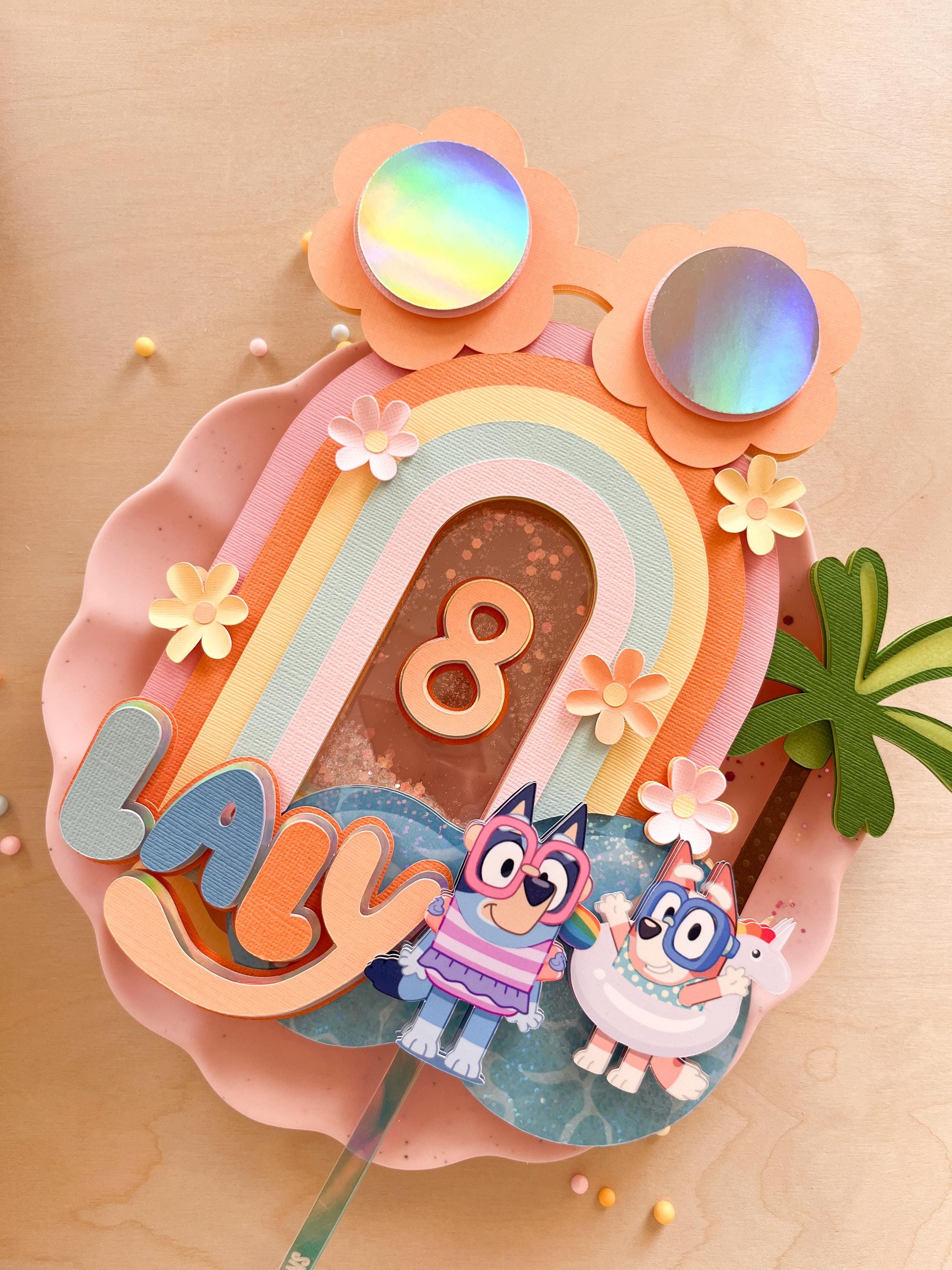 Blue and orange dog cake topper