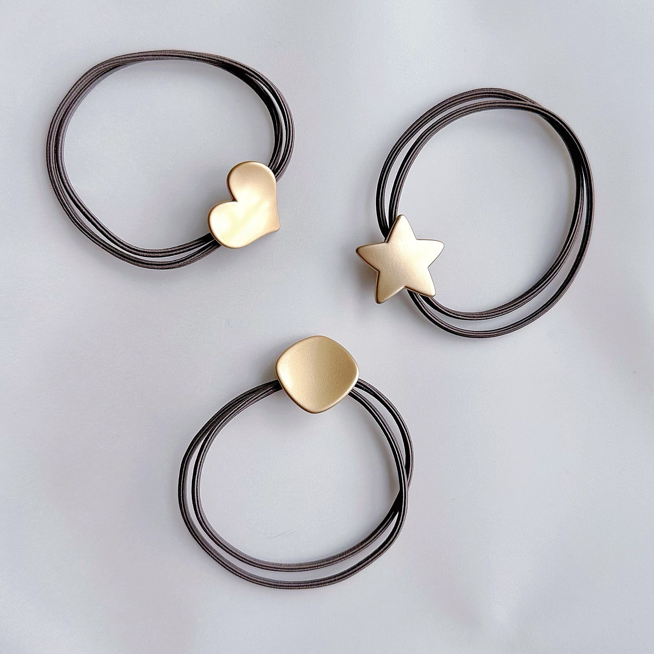 Heart With Star Hair Tie | Cody Sanderson | Sorrel Sky Gallery
