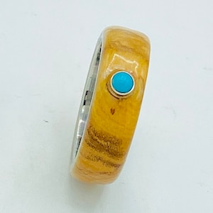 Wild Bethlehem Olive Wood and Turquoise cabochon inset on Titanium ring core