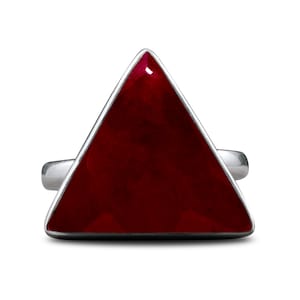 May include: A silver ring with a triangular red gemstone.