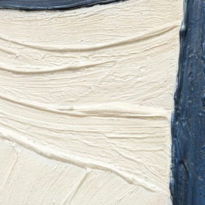May include: A textured painting featuring thick, layered off-white paint with visible brushstrokes and palette knife marks, contrasted by a vertical band of deep navy blue paint on the right side and a dark blue horizontal edge at the top.