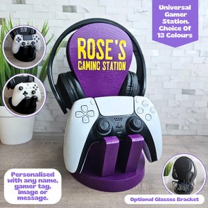 May include: A purple gaming station with a white and black game controller, black headphones, and the text "ROSE'S GAMING STATION." The station has a holder for the controller and headphones. The text "Universal Gamer Station. Choice Of 13 Colours" is also visible.