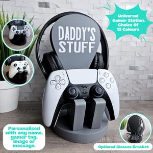May include: A gray gaming station with a personalized sign that says "Daddy's Stuff". The station has a headset holder, a controller holder, and an optional glasses bracket. The station is available in 13 colors.