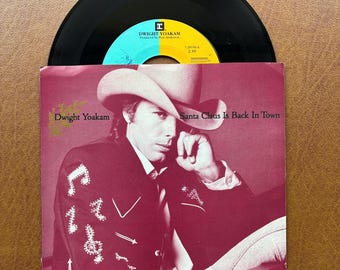 Dwight Yoakam Santa Claus Is Back In Town/Christmas Eve With The Babylonian Cowboys Jingle Bells (EX) 7” 45 rpm 1987 Vintage Vinyl Reprise.