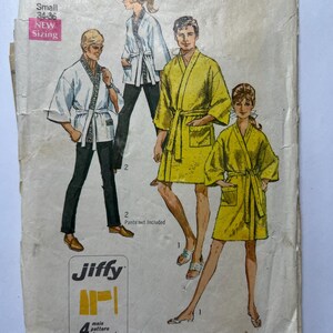 May include: Vintage Simplicity sewing pattern envelope featuring illustrations of people wearing robes. The envelope reads "Men Small 34-36" and "Jiffy". The pattern includes four main pieces and is described as "easy cut easy sew".