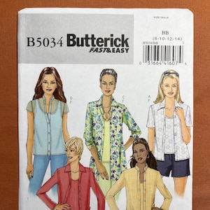 May include: Butterick B5034 sewing pattern featuring illustrations of women's clothing designs. The pattern includes various styles of tops, jackets, and pants. The cover displays the text "FAST & EASY" and the size range.
