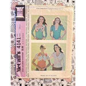 May include: McCall's Patterns 4141 sewing pattern envelope for misses' blouses. The front features four illustrations of tops for unbonded stretchable knits, with text including the pattern number 4141, size small, and price $1.00.