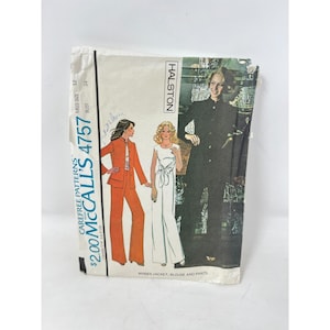 May include: A vintage McCall's 4757 sewing pattern envelope featuring Halston designs. The cover displays illustrations of a jacket, blouse, and pants set in orange and white, alongside a photograph of a person wearing a black jacket and pants.