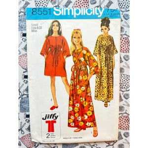 May include: Simplicity pattern 8551 for a miss size 8-10 dress. The envelope features illustrations of three variations of a dress with a tie waist and wide sleeves: a solid red short dress, a floral print maxi dress, and a leopard print maxi dress.