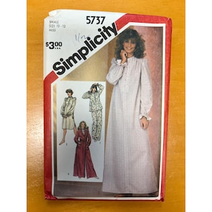May include: A Simplicity 5737 sewing pattern envelope for size small 10-12 miss. The front features illustrations of a long-sleeved nightgown, a pajama set, and a robe. The main image shows a light-colored, long-sleeved nightgown with a small floral print.