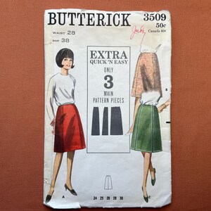 May include: Vintage Butterick sewing pattern 3509 featuring a skirt design. The pattern includes illustrations of the skirt in red and green, with the text "EXTRA QUICK 'N EASY" and "ONLY 3 MAIN PATTERN PIECES". Waist 28 inches, Hip 38 inches.