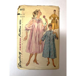 May include: A Simplicity sewing pattern envelope, number 4972, size 14, bust 32. The illustration shows three garment styles: a pink robe with lace trim, a blue patterned coat with buttons, and a yellow coat with pockets and a tie waist.