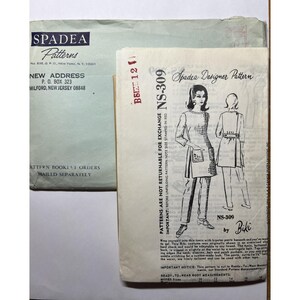 May include: Vintage Spadea Designer Pattern NS-309 by Biki. The pattern packet features illustrations of a tunic with hipster pants. The envelope is light green with the Spadea Patterns logo and address information.
