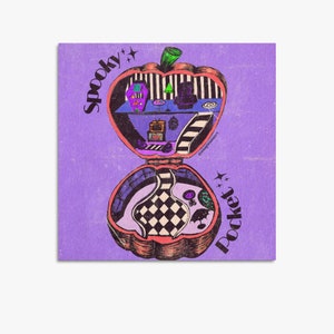 May include: A purple background with a spooky pocket-sized house shaped like a pumpkin. The house is open and shows a black and white checkered floor, a purple couch, a black armchair, a television, and a black and white striped staircase. The text "Spooky Pocket" is written on the house.