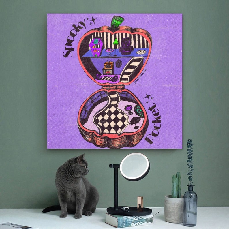 May include: A purple background with a spooky pocket illustration of a pumpkin with a house inside. The text "Spooky Pocket" is written on the left side of the image and the text "Pocket" is written on the right side of the image.
