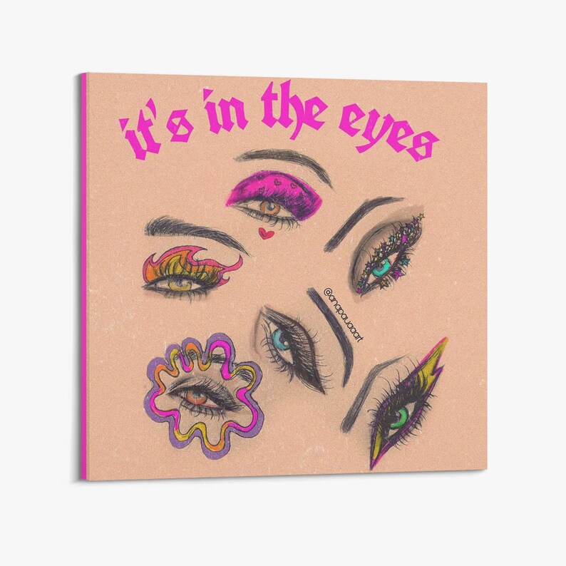 May include: A digital illustration of various eyes with different makeup styles. The eyes are drawn in a cartoon style with bright colors and bold lines. The text "it's in the eyes" is written in pink letters at the top of the image.