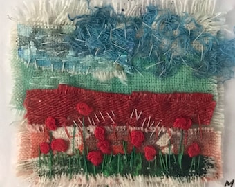 Stitch and fabric landscape poppy field