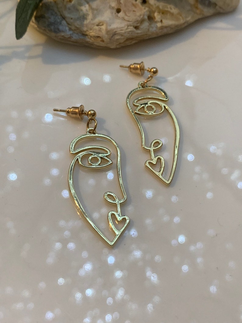 Every face have a story behind\u201d women\u2019s face earrings